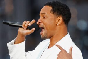 Will Smith cantando durante evento em homenagem ao Nelson Mandela