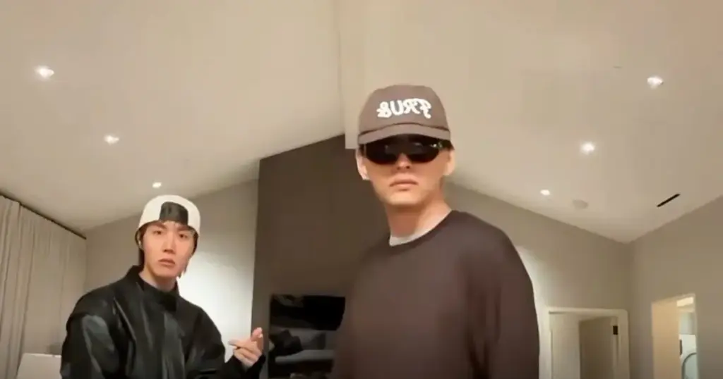 J-Hope e V, do BTS, ao escutar Drake (reprodução)